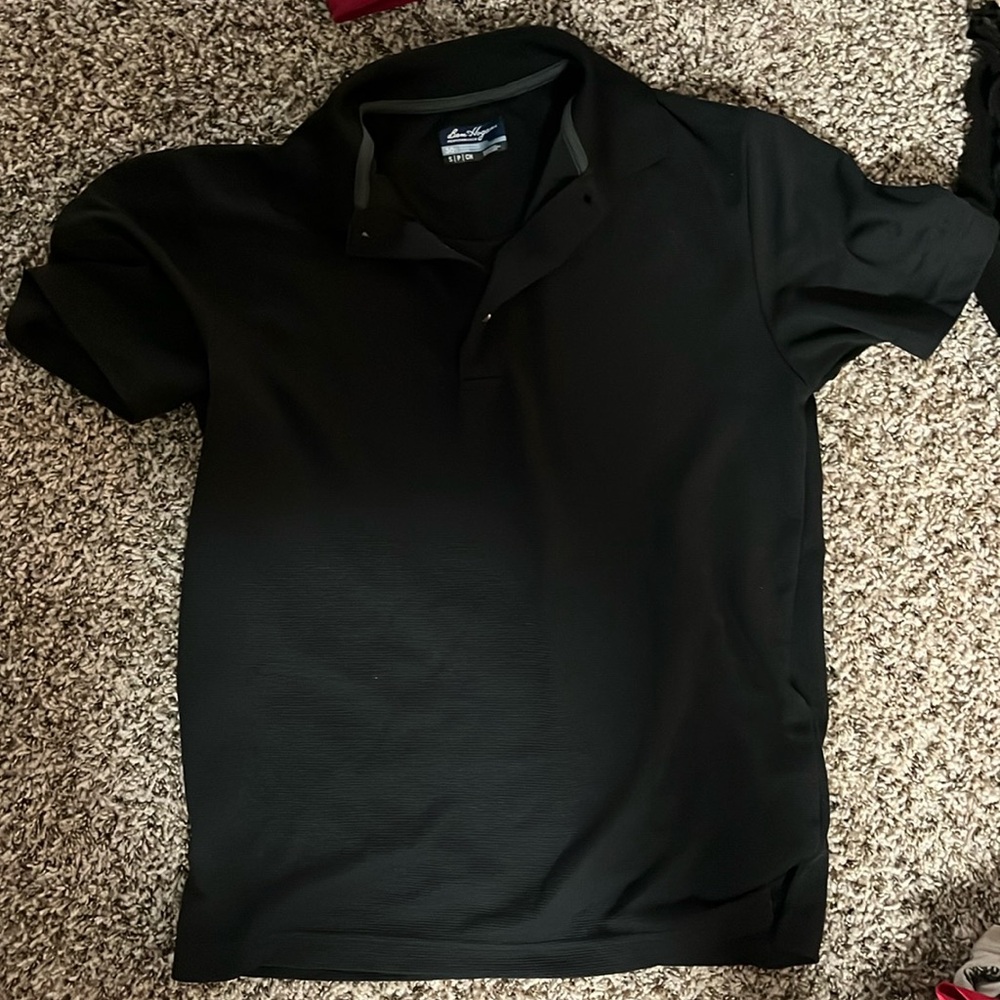 Black polo. Unisex, good for work attire
